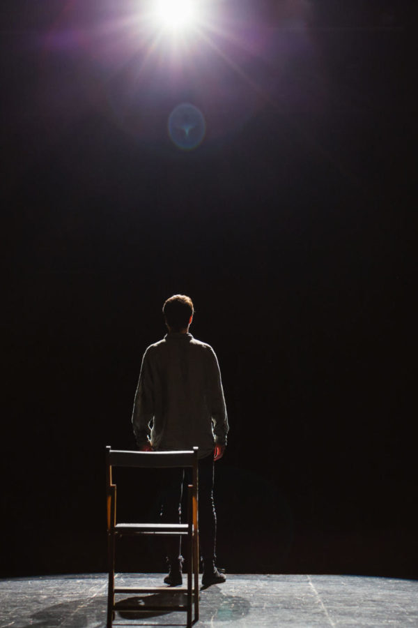 Back View Of An Actor Performing A Play.